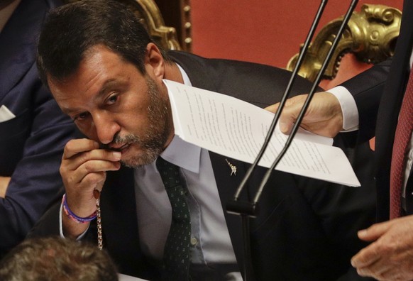 FILE - In this Aug. 20, 2019, file photo, Italian Deputy-Premier Matteo Salvini kisses a rosary as Premier Giuseppe Conte addresses the Senate in Rome. For months now, Salvini, a divorced father of tw ...