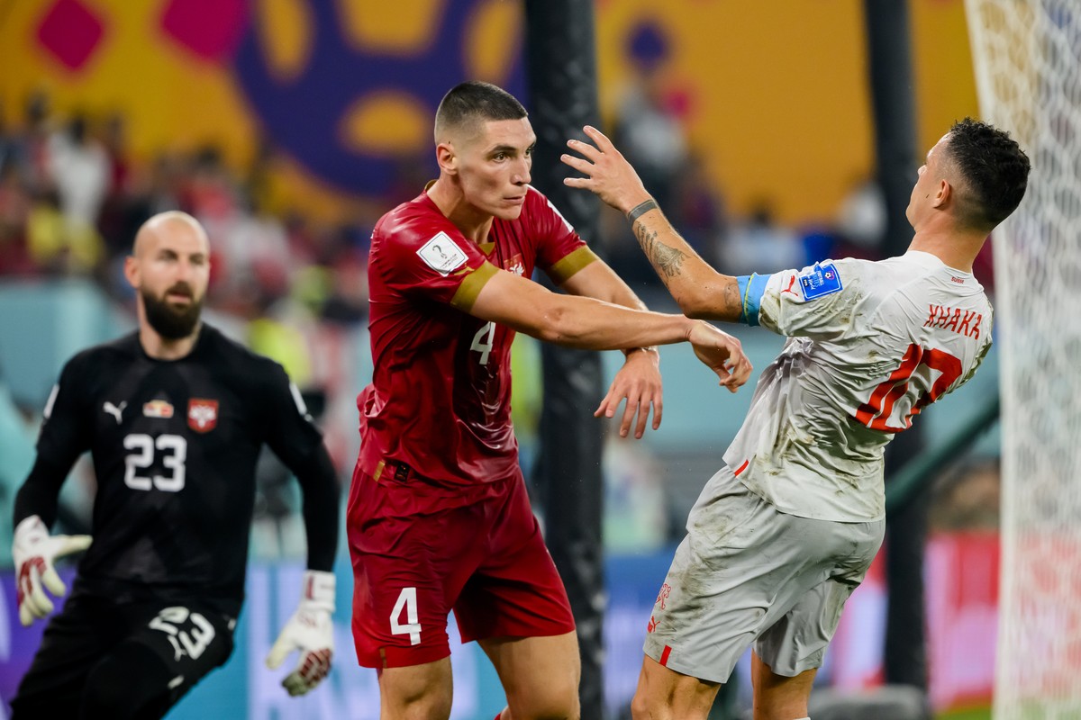 Switzerland's midfielder Granit Xhaka, right, talks with Serbia's goalkeeper Vanja Milinkovic-Savic and Serbia's defender Nikola Milenkovic during the FIFA World Cup Qatar 2022 group G  ...