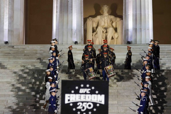 KEYPIX - epa13033884 Members of the US Army Band and a joint service honor guard perform during the UFC Freedom 250 press conference at the Lincoln Memorial in Washington, DC, USA, 12 June 2026. The U ...