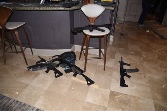 epa06459031 A handout photo made available by the Las Vegas Metropolitan Police Department on 20 January 2018 showing the view from the sitting area of room 32-135 with numerous weapons at the Mandala ...
