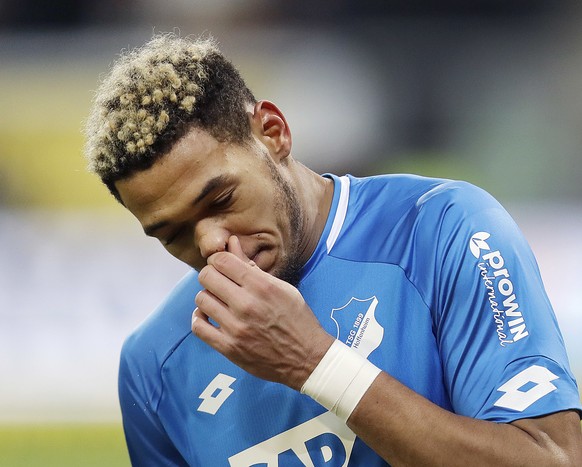 Hoffenheim&#039;s Joelinton wipes his nose during a German Bundesliga soccer match between TSG 1899 Hoffenheim and Borussia Moenchengladbach in Sinsheim, Germany, Saturday, Dec. 15, 2018. (AP Photo/Mi ...