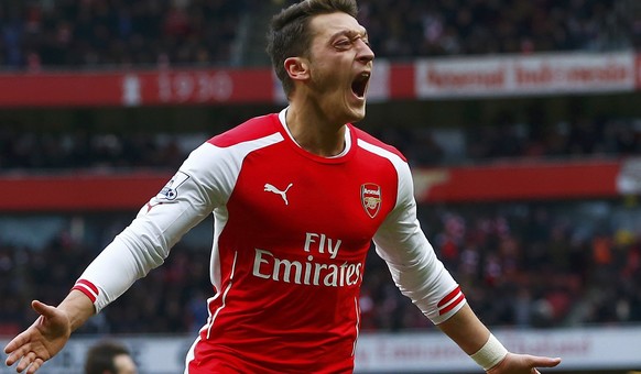 Arsenal&#039;s Mesut Ozil celebrates his goal against Aston Villa during their English Premier League soccer match at the Emirates Stadium in London, February 1, 2015. REUTERS/Eddie Keogh (BRITAIN - T ...