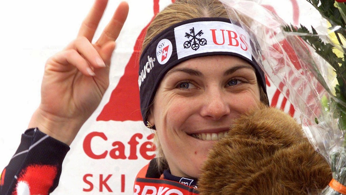 Karin Roten of Switzerland shows the victory sign to fans on the podium after winning the women's ski world cup slalom in Veysonnaz, Switzerland, December 20, 1998. Roten won the race with a time ...