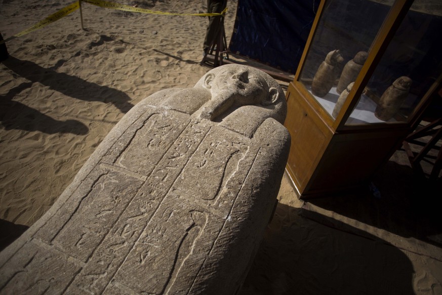 epa06560941 A sarcophagus that was discovered is displayed at the site of an ancient Egyptian cemetery, in Minya province, 245 km south of Cairo, Egypt, 24 February 2018. According to the Ministry of  ...