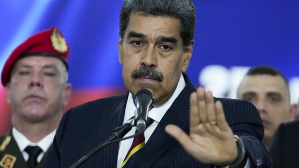 Venezuelan President Nicolas Maduro speaks to the press before leaving the Supreme Court where he arrived for procedures related to the court&#039;s audit of presidential election results in Caracas,  ...