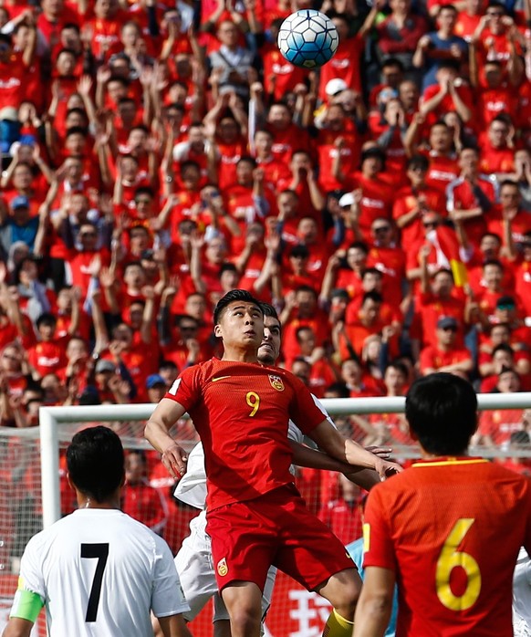 epa05875173 Iran&#039;s Saeid Ezatollahi (C, rear) in action against China&#039;s Zhan Yuning (C, front) during the FIFA World Cup 2018 qualification soccer match between Iran and China at the Azadi s ...