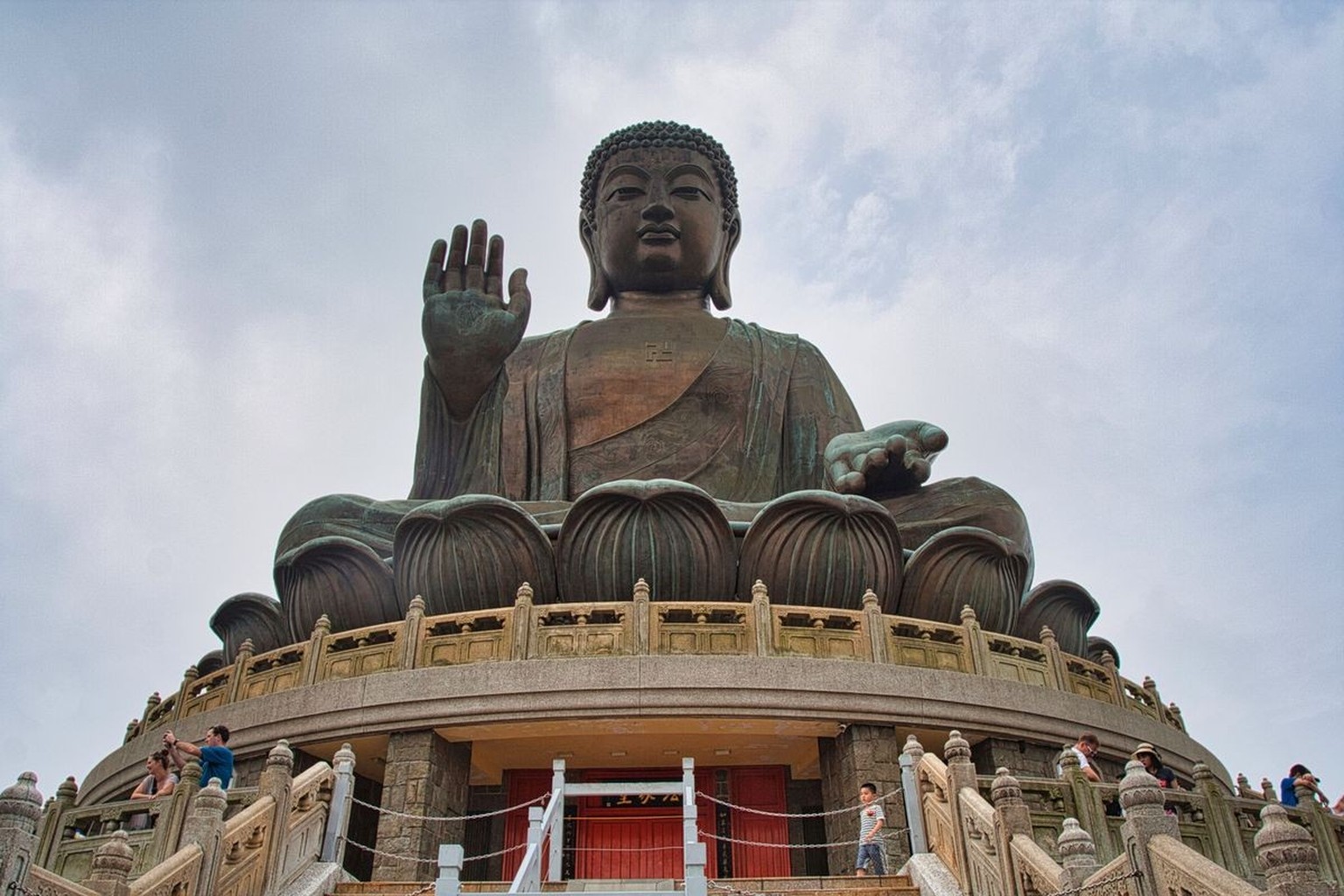 A majestic view of Tian Tan Buddha, an iconic statue situated on Lantau Island, Hong Kong Model Released Property Released xkwx ancient buddha clouds colossal culture far giant grand hill hong horizon ...