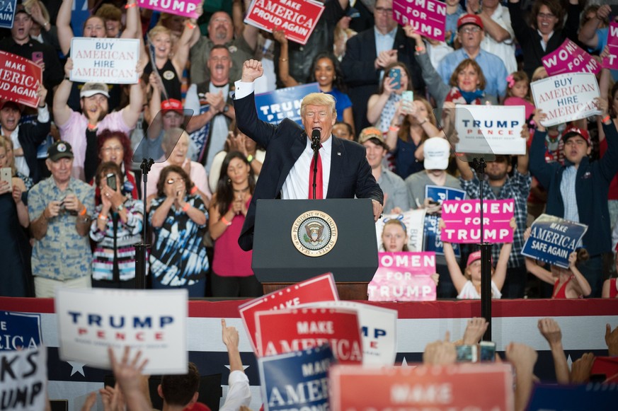 epa05936303 US President Donald J. Trump makes fist as he speaks at the Pennsylvania Farm Show Complex in Harrisburg, Pennsylvania, USA, 29 April 2017. The rally marked the president&#039;s 100th day  ...