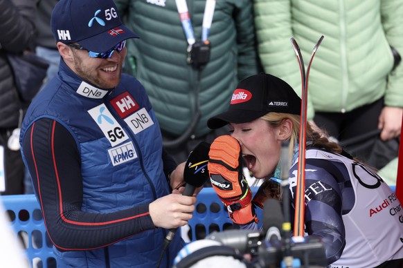Norway's Aleksander Aamodt Kilde, left, interviews United States' Mikaela Shiffrin after she won an alpine ski, women's World Cup giant slalom race, in Soldeu, Andorra, Sunday, March 19 ...