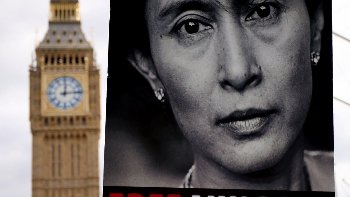 epa12289632 A person holds a placard of former State Counsellor of Myanmar Aung San Suu Kyi as Burmese people gather to mark the 08 August uprising against the military junta in Myanmar at Parliament  ...