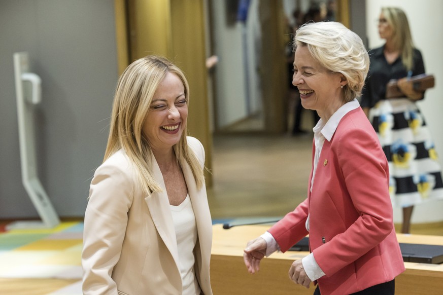 Italy&#039;s Prime Minister Giorgia Meloni, left, greets European Commission President Ursula von der Leyen during a round table meeting at an EU summit in Brussels, Thursday, June 29, 2023. European  ...
