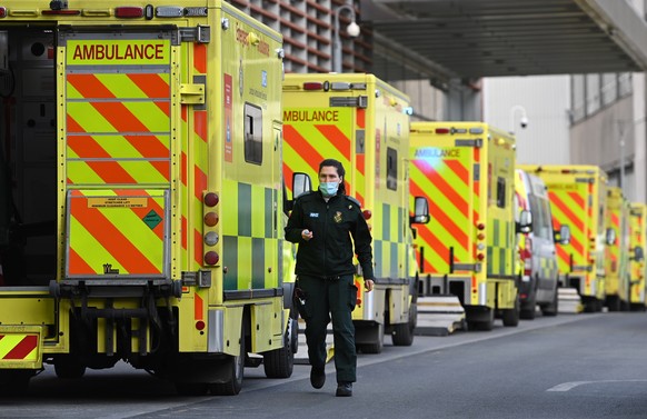 epa09009142 Ambulance staff outside the Royal London hospital in London, Britain, 13 February 2021. Britain&#039;s National health service (NHS) has been under sever pressure even as Covid-19 hospital ...