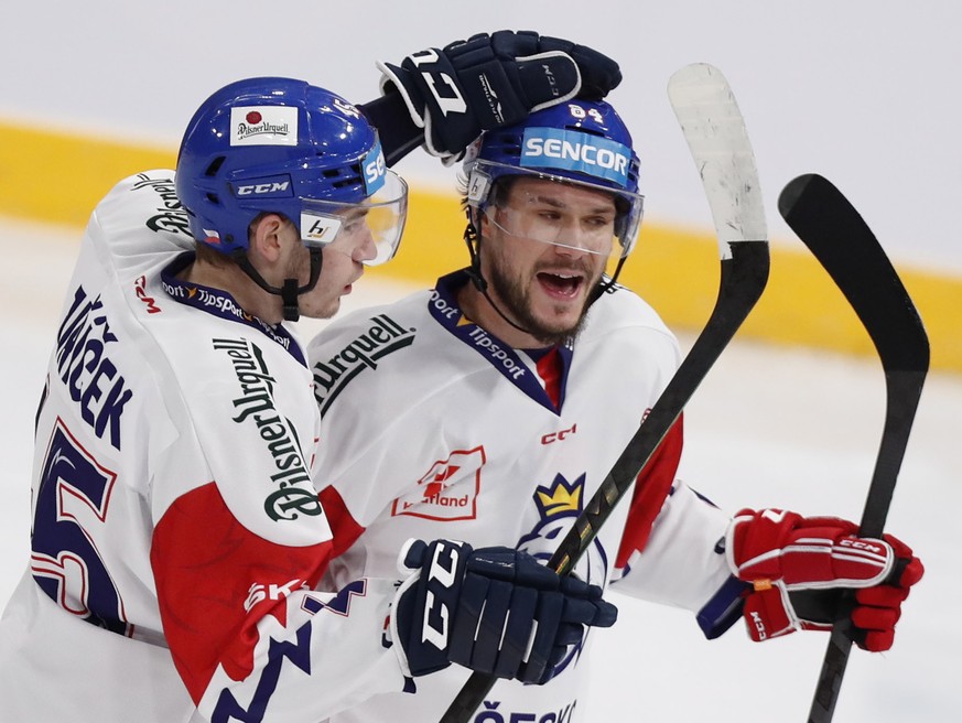 epa09933469 Czech Republic&#039;s Tomas Kundratek (R) celebrate his teams first goal with David Jiricek (L) during the Beijer Hockey Games (Euro Hockey Tour) ice hockey match between Switzerland and C ...