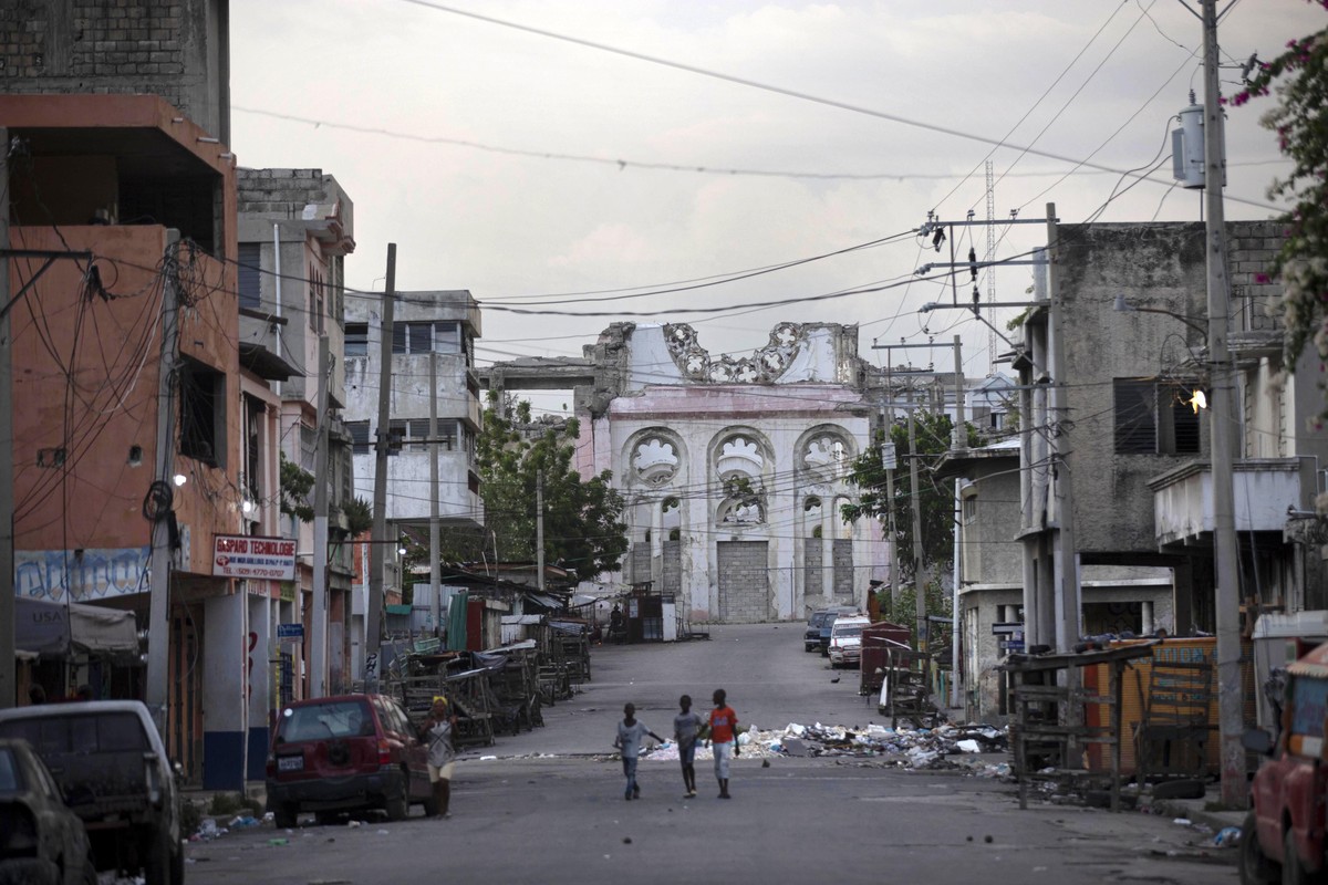 Children walk on an empty street in front of the cathedral that was destroyed by the 2010 earthquake in Port-au-Prince, Haiti, Wednesday, July 7, 2021. Haiti���s President Jovenel Moise has been assas ...