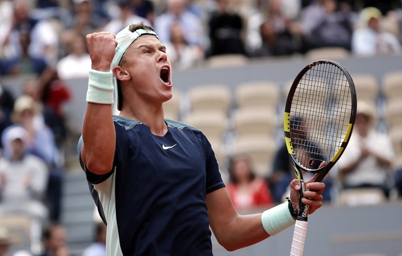 epa09986250 Holger Rune of Denmark reacts as he plays Stefanos Tsitsipas of Greece in their men?s fourth round match during the French Open tennis tournament at Roland ?Garros in Paris, France, 30 May ...