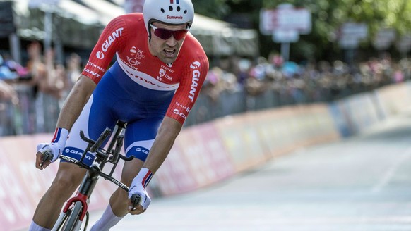 Tom Dumoulin takes a curve on his way to win the 10th stage of the Giro d&#039;Italia, Tour of Italy cycling race, an individual time trial from Foligno to Montefalco, Tuesday, May 16, 2017. Dutch rid ...