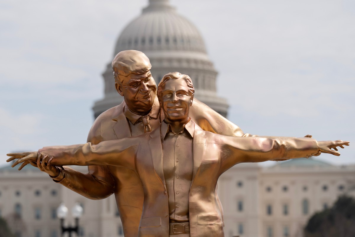 A statue depicting President Donald Trump and Jeffrey Epstein stands on the National Mall near the U.S. Capitol, Wednesday, March 11, 2026, in Washington. (AP Photo/Jose Luis Magana)