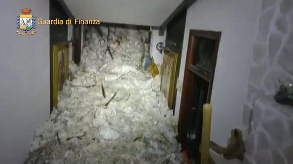 epa05732073 A handout photo made available by the Italian Guardia di Finanza showing snow fill up the interior of the hotel Rigopiano in the town of Farindola, overwhelmed the previous night by a snow ...