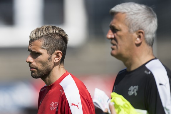 Swiss soccer player Valon Behrami, left, and Swiss national soccer head coach Vladimir Petkovic, right, react during a team&#039;s training session in Lugano, Switzerland, Wednesday, June 1, 2016. The ...