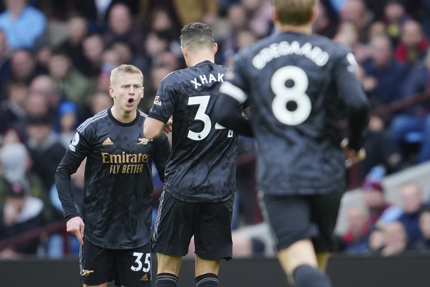 Arsenal&#039;s Oleksandr Zinchenko, left, celebrates after scoring his side&#039;s second goal during the English Premier League soccer match between Aston Villa and Arsenal at Villa Park in Birmingha ...