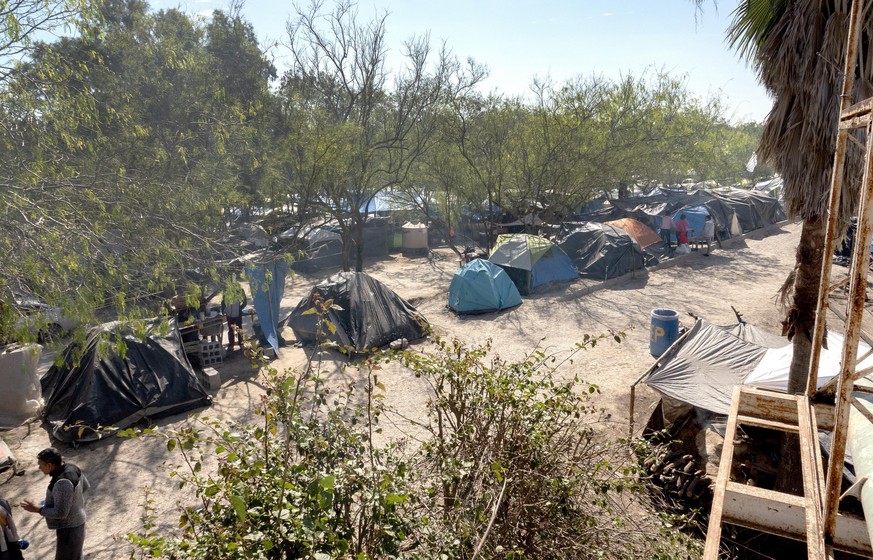 epa08414387 Central American refugees camp at the Matamoros refugee camp, in the side of Matamoros, Tamaulipas, Mexico, 27 February 2020 (issued 11 May 2020). The town of Matamoros is only a few short ...