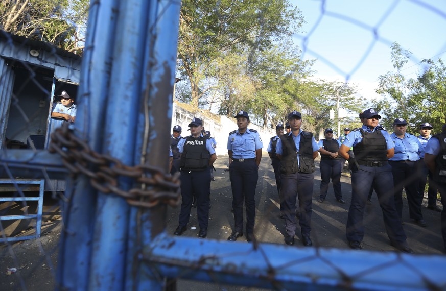 FILE - Police stand guard at a shelter known as "El Chipote," associated with torture during the Somoza dictatorship (1937-1979) and officially named the Director of Judicial Assistance…
