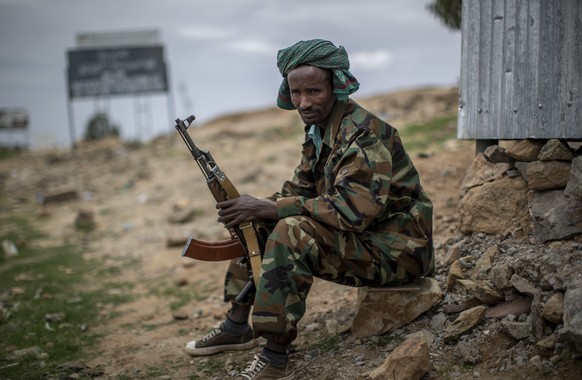 A fighter loyal to the Tigray People&#039;s Liberation Front (TPLF) mans a guard post on the outskirts of the town of Hawzen, then-controlled by the group but later re-taken by government forces, in t ...