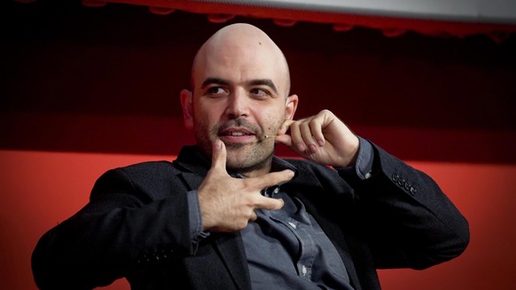 epa06270070 Italian writer Roberto Saviano attends the presentation of his new novel &#039;Bacio Feroce&#039; (Ferocious kiss) in the Cinema &#039;Modernissimo&#039; in Naples, 16 October 2017. EPA/CI ...