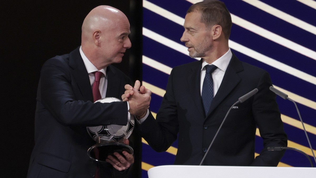 epa12730355 FIFA President Gianni Infantino (L) and UEFA President Aleksander Ceferin (R) attend the 50th UEFA Ordinary Congress in Brussels, Belgium, 12 February 2026. EPA/CHRISTOPHER NEUNDORF