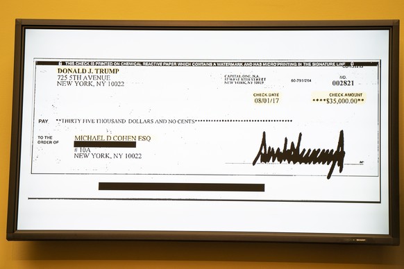 epaselect epa07401781 An image of the 35,000 US dollar check, signed by President Trump, that was allegedly used for hush money, on a TV screen as Michael Cohen (not pictured), former attorney to US P ...