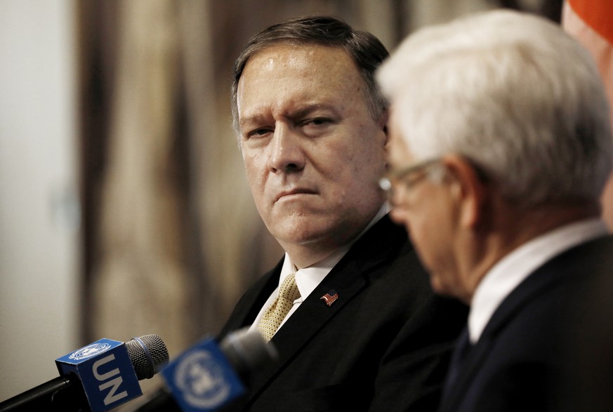 epa07783164 US Secretary of State Mike Pompeo (L) listens as Jacek Czaputowicz (R), Foreign Minister of Poland, speaks at a joint press conference at the United Nations headquarters in New York, New Y ...