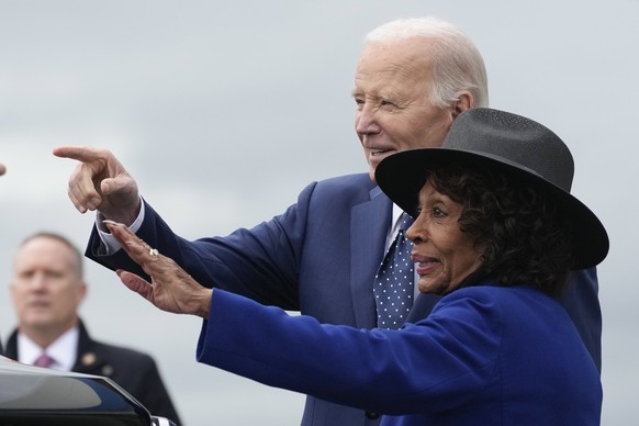 President Joe Biden waves with Rep. Maxine Waters, D-Calif., as he arrives at Los Angeles International Airport, Tuesday, Feb. 20, 2024, in Los Angeles. (AP Photo/Manuel Balce Ceneta)