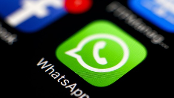 epa05247661 The logo of the messaging application WhatsApp is pictured on a smartphone in Taipei, Taiwan, 07 April 2016. WhatsApp on 05 April 2016 rolled out its end-t-end (E2E) encryption for its mor ...