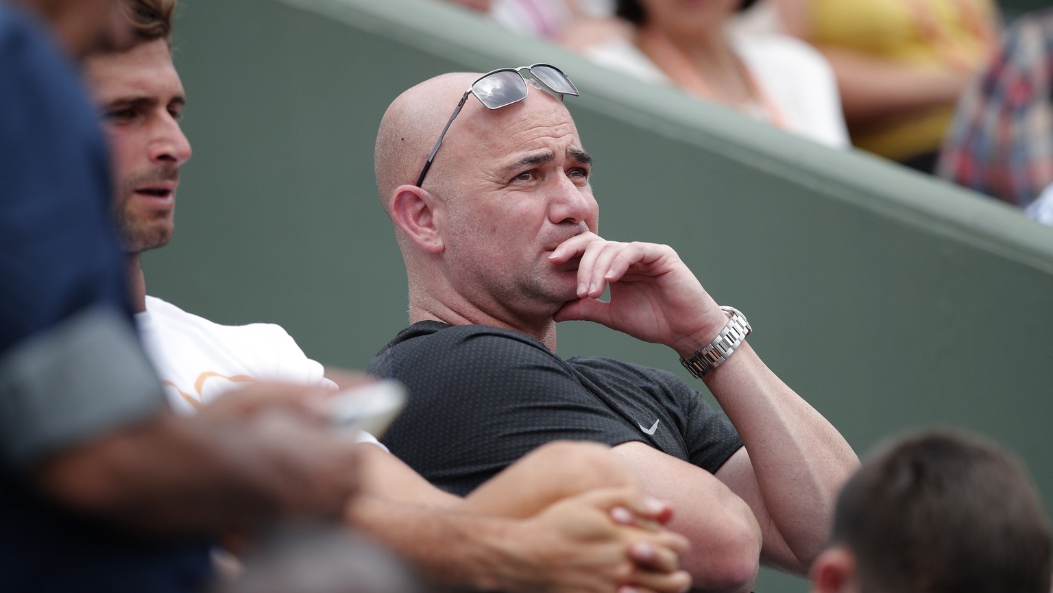 Novak Djokovic&#039;s coach Andre Agassi of the U.S. watches the match against Spain&#039;s Marcel Granollers during their first round match of the French Open tennis tournament at the Roland Garros s ...