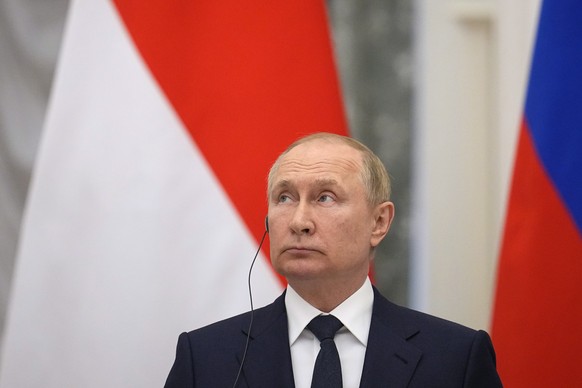 epa10044005 Russian President Vladimir Putin attends a joint news conference with Indonesian President Joko Widodo after their meeting in the Kremlin in Moscow, Russia, 30 June 2022. Widodo is on a pe ...