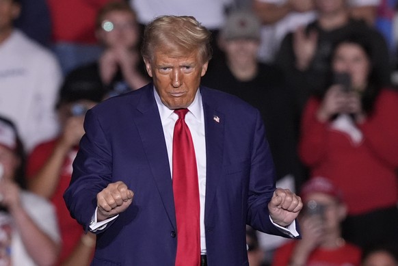 Republican presidential nominee former President Donald Trump dances at a campaign event at the Ryder Center at Saginaw Valley State University, Thursday, Oct. 3, 2024, in University Center, Mich. (AP ...