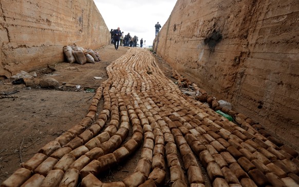 epa07401453 A view of packs which Syrian authorities say contain highly-explosive C4 material left behind by armed groups, during a government-organized tour in the southern region of Daraa, Syria, 27 ...