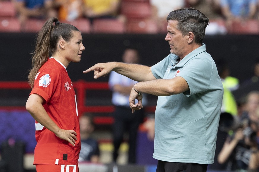 Switzerland's head coach Nils Nielsen, right, instructs Switzerland's forward Ramona Bachmann, left, during the UEFA Women's England 2022 group C preliminary round soccer match between Switzerland and ...