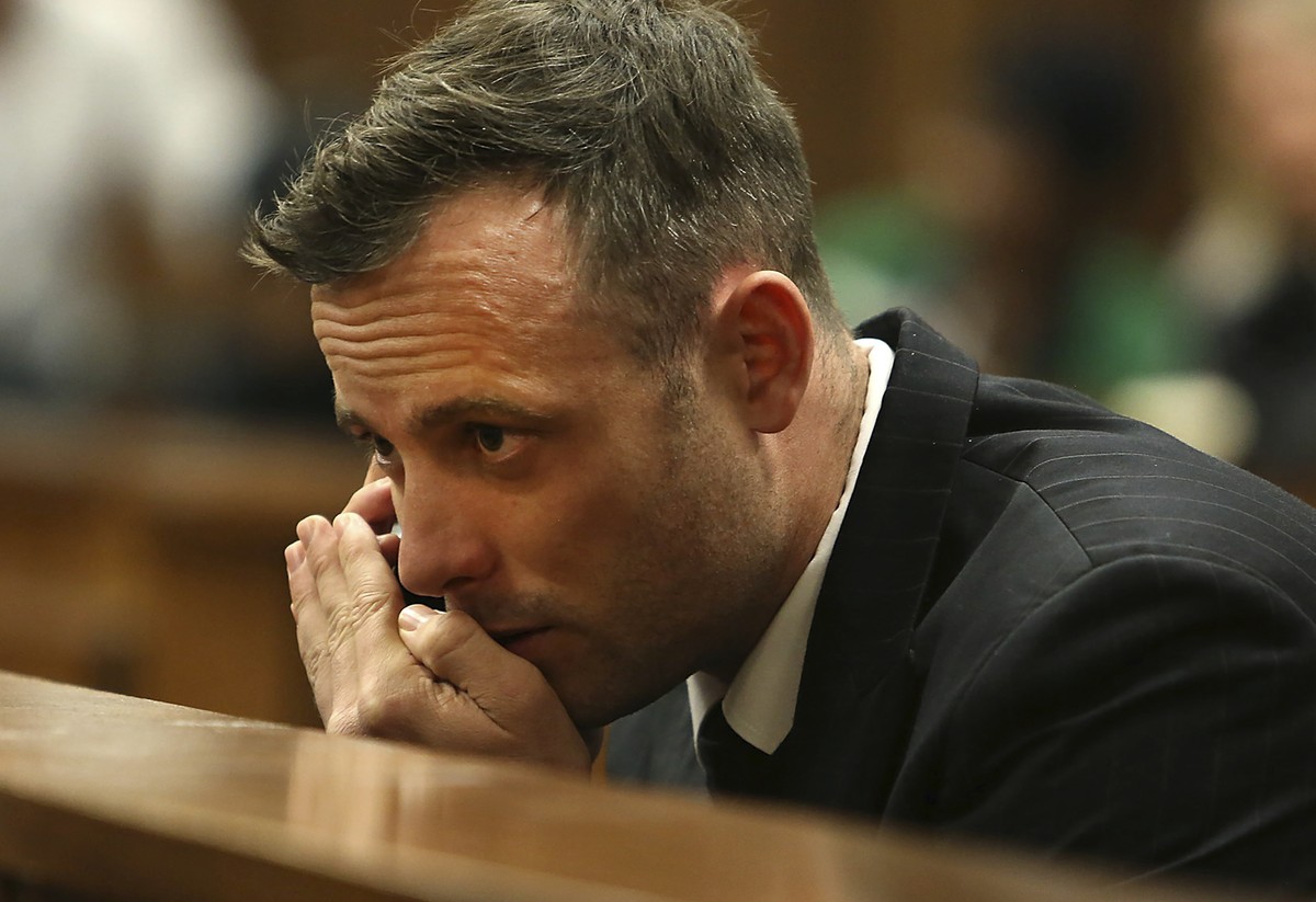 FILE - Oscar Pistorius speaks on a mobile phone in the High Court in Pretoria, South Africa, June 15, 2016 during his sentencing hearing for murdering girlfriend Reeva Steenkamp. Pistorius has applied ...