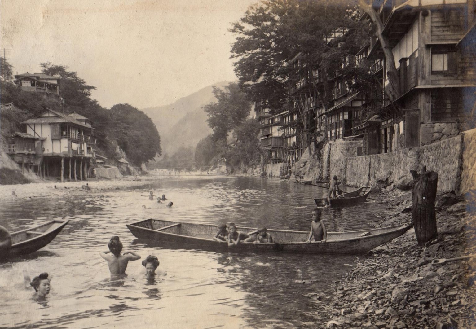 People bathing in a river during the summer. Japan, 1915