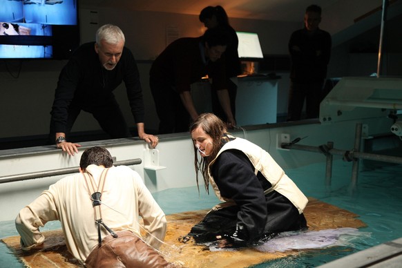 James Cameron checks in on Josh Bird and Kristine Zipfel, who are exposed to frigid waters to test the impacts of hypothermia. (National Geographic/Spencer Stoner)