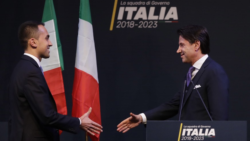 In this photo taken on Thursday, March 1, 2018, Giuseppe Conte, right, shakes hands with leader of the Five-Star Movement, Luigi Di Maio, during a meeting in Rome. Italian media describe Conte as most ...