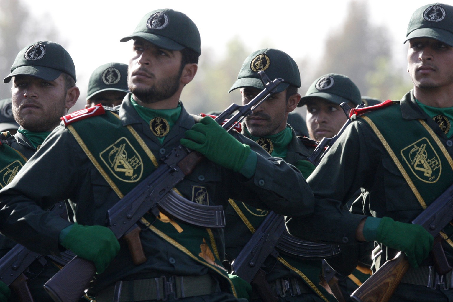 In this picture taken on Sunday, Sept. 21, 2008, Iranian Revolutionary Guards members march during a parade ceremony, marking the 28th anniversary of the onset of the Iran-Iraq war (1980-1988), in fro ...