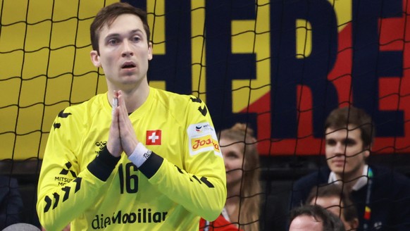 epa11076972 Switzerland?s goalkeeper Nikola Portner reacts during the Men&#039;s EHF EURO 2024 Handball preliminary round ? group A match between Switzerland and France in Berlin, Germany, 14 January  ...