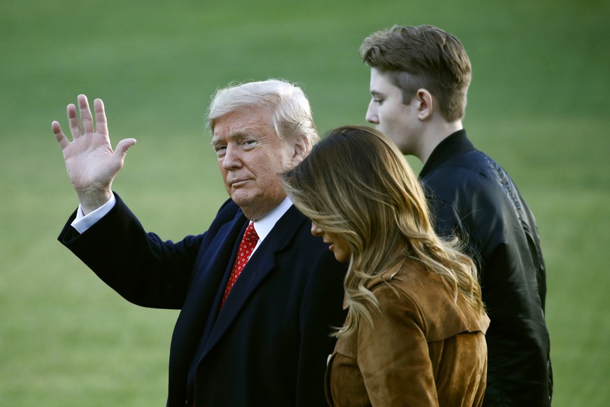 President Donald Trump walks with first lady Melania Trump and son Barron Trump on the South Lawn of the White House in Washington, Tuesday, Nov. 26, 2019, before boarding Marine One for a short trip  ...