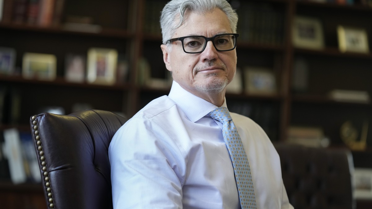 FILE - Judge Juan M. Merchan poses in his chambers in New York, March 14, 2024. Merchan is the judge presiding over Donald Trump's hush money trial. He was also the judge in the Trump Organizatio ...