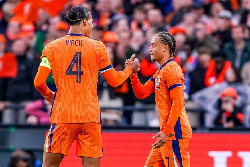 2024-06-10 Netherlands v Iceland - Friendly International ROTTERDAM, NETHERLANDS - JUNE 10: Xavi Simons of Netherlands celebrates after scoring his sides first goal with Virgil van Dijk of Netherlands ...