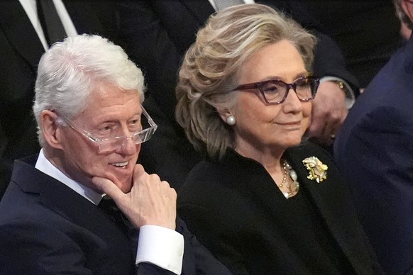 FILE - Former President Bill Clinton and former Secretary of State Hillary Clinton listen during the state funeral for former President Jimmy Carter at Washington National Cathedral in Washington, Jan ...
