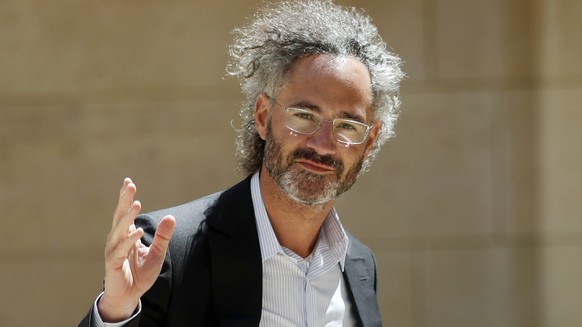 FILE - In this Wednesday, May 15, 2019, file photo, Palantir CEO Alex Karp arrives for the Tech for Good summit in Paris. Seventeen years after it was born with the help of CIA seed money, Palantir Te ...