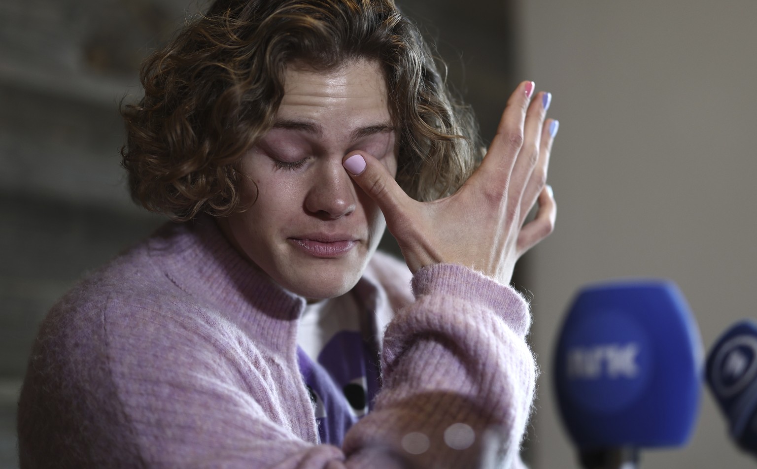 Norway&#039;s Lucas Braathen wipes his tears during a press conference in Soelden, Austria, Friday, Oct. 27, 2023. (AP Photo/Gabriele Facciotti)
